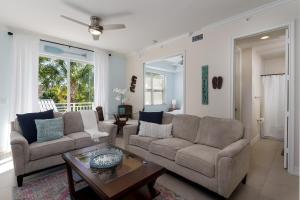 a living room with two couches and a coffee table at -The Bonita Paddle 2 2- Your Home Away From Home in Paradise condo in Bonita Springs +11 photos