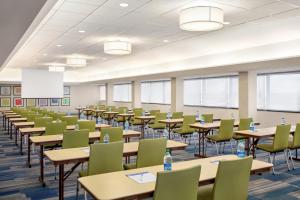 an empty classroom with tables and chairs at Holiday Inn Express - San Antonio Airport, an IHG Hotel in San Antonio