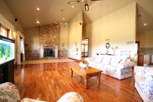 a living room with a couch and a table at Relaxin in Dural