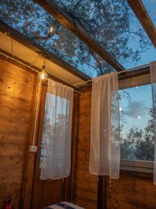 a room with a window with a curtain at Agriturismo S.Ilario in Genoa