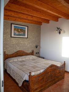 A bed or beds in a room at Agriturismo S.Ilario