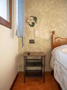 A bed or beds in a room at Agriturismo S.Ilario