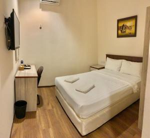 Letto o letti in una camera di AMB LAI LAI HOTEL