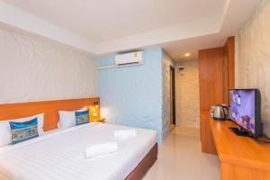 Letto o letti in una camera di Lightplus Khao Lak