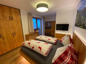 Postel nebo postele na pokoji v ubytování Chalet Tauernbär