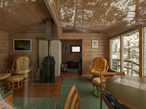 a room with chairs and a table in a house at #casakivicco in Leppävirta