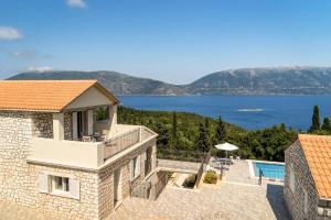 a villa with a view of the water at Villa Gionis in Fiskardho