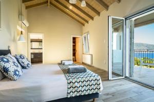 Postel nebo postele na pokoji v ubytování Villa Gionis