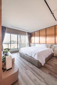 Postel nebo postele na pokoji v ubytování Luxury Ki Kotobuki Place