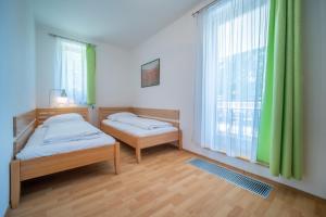 Ένα ή περισσότερα κρεβάτια σε δωμάτιο στο Apartment Riviera 507-6 Lipno Home