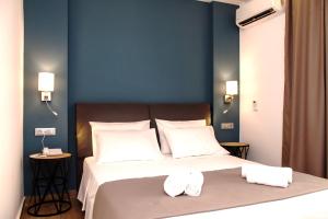 Ένα ή περισσότερα κρεβάτια σε δωμάτιο στο Sunrise Luxury Apartments Rhodes