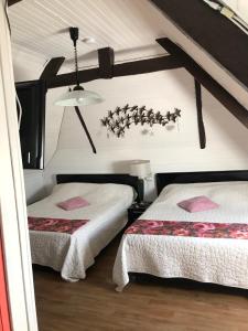 Кровать или кровати в номере Chambres d'Hôtes de la Presqu'Île