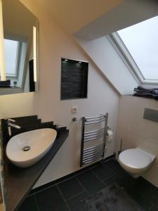 A bathroom at Modern Chalet Style in traditional village home with free WiFi & optional Wallbox