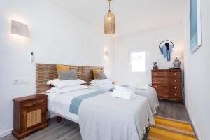 A bed or beds in a room at Vista La Janda - Califa Casas Vejer