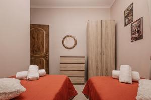 En eller flere senge i et værelse på Flower Garden House