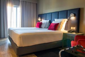 Кровать или кровати в номере Melia Setubal