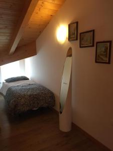 Een bed of bedden in een kamer bij B&B Benvenuti - Dolomiti di Brenta