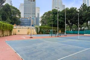 a tennis court in the middle of a city at VEGA by Kozystay 3BR SCBD in Jakarta