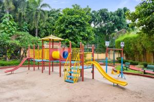 a playground in a park with a slide at VEGA by Kozystay 3BR SCBD in Jakarta