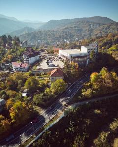 an overhead view of a city with a train tracks at Hotel Belvedere in Braşov