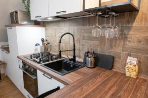 a kitchen with a sink and a counter at Acqua Dolce in Capodimonte