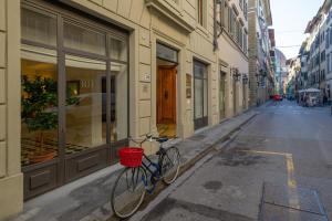 a bike parked on the side of a street at Residence Hilda in Florence