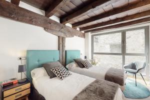 Tempat tidur dalam kamar di Casa Rural Ixurkonea