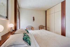 Postel nebo postele na pokoji v ubytování Troia Seaside + 13 fotografií