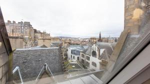 a view of a city from a window at Linton Collection - 28 North Bridge in Edinburgh