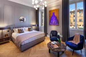 Una cama o camas en una habitación de Migliori Collection Piazza Navona