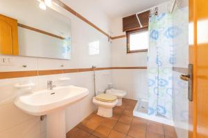 Koupelna v ubytování Residence Caletta + 37 fotografií