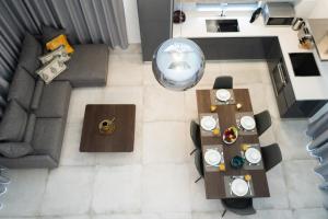 an overhead view of a living room with a couch and tables at Napa Hills Seaview Villas in Ayia Napa