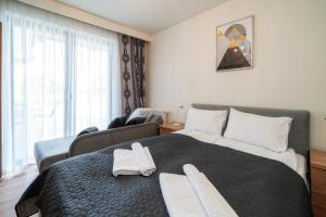 Posteľ alebo postele v izbe v ubytovaní Resorts G Białka Tatrzańska z sauną, Sun & Snow