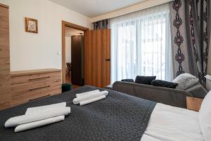 Posteľ alebo postele v izbe v ubytovaní Resorts G Białka Tatrzańska z sauną, Sun & Snow