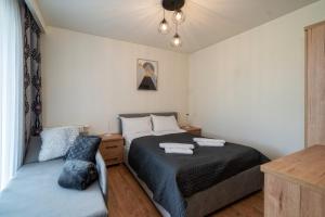 Posteľ alebo postele v izbe v ubytovaní Resorts G Białka Tatrzańska z sauną, Sun & Snow