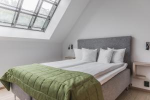 Ліжко або ліжка в номері The More Hotel Lund