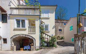 a building with an archway in front of a building at Beautiful Home In Kastav With Kitchen in Kastav