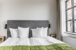 Ліжко або ліжка в номері The More Hotel Lund