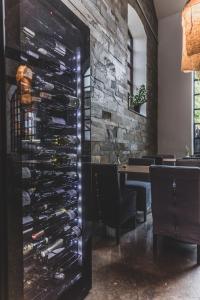 a wine cellar in a restaurant with a wall of wine bottles at The More Hotel Lund in Lund