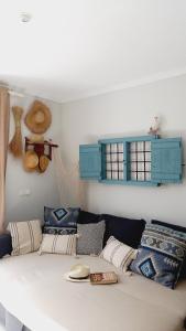 a living room with a couch with pillows at Casa Salá, alojamiento con encanto en Vera Natura in Vera +38 photos