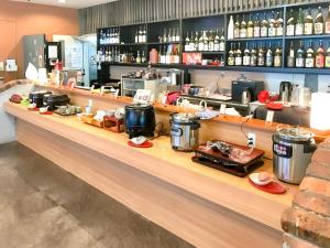 a counter in a restaurant with a counter top at LiVEMAX RESORT Sakurajima Sea Front in Tarumizu