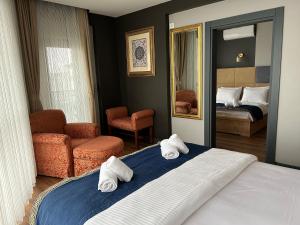 Postel nebo postele na pokoji v ubytování Taşliman Otel