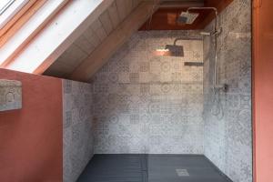 a attic room with a shower with a mattress at La Maison de Loup by Totiaran in Escuñau +42 photos