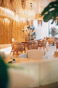 a dining room with a table and chairs at White Hill Hotel, SPA & Conferences in Durrës