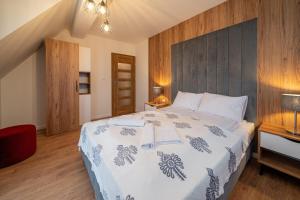 Posteľ alebo postele v izbe v ubytovaní Resorts G Białka Tatrzańska z sauną, Sun & Snow
