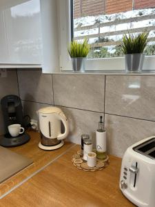 Kuchyň nebo kuchyňský kout v ubytování Amaretto Apartamenty Solina - balia z jacuzzi i sauna + 37 fotografií
