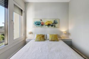 Ένα ή περισσότερα κρεβάτια σε δωμάτιο στο Apartamento T1 - Tróia Resort