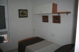 A bed or beds in a room at Piso lujo el toyo
