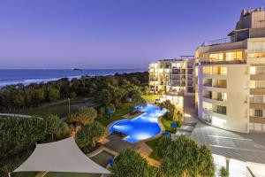 an aerial view of a resort with a swimming pool at Ramada By Wyndham Marcoola Beach in Marcoola