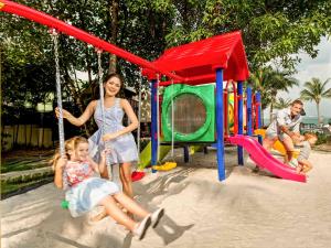 a group of people playing on a playground at Hotel Ibis Samui Bophut in Bophut
